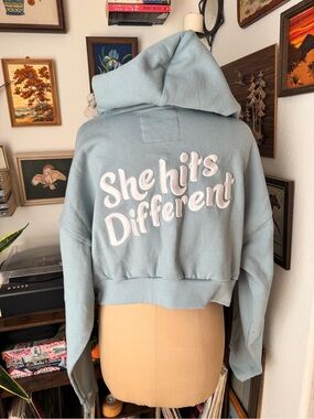 Cake Cropped Hoodie Light Blue Embroidered “ She hits Different “ Size Large